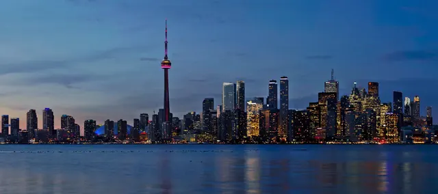 Toronto skyline at dusk — Canada's economic capital and the destination at the centre of a major 2026 reset in India-Canada business immigration and trade