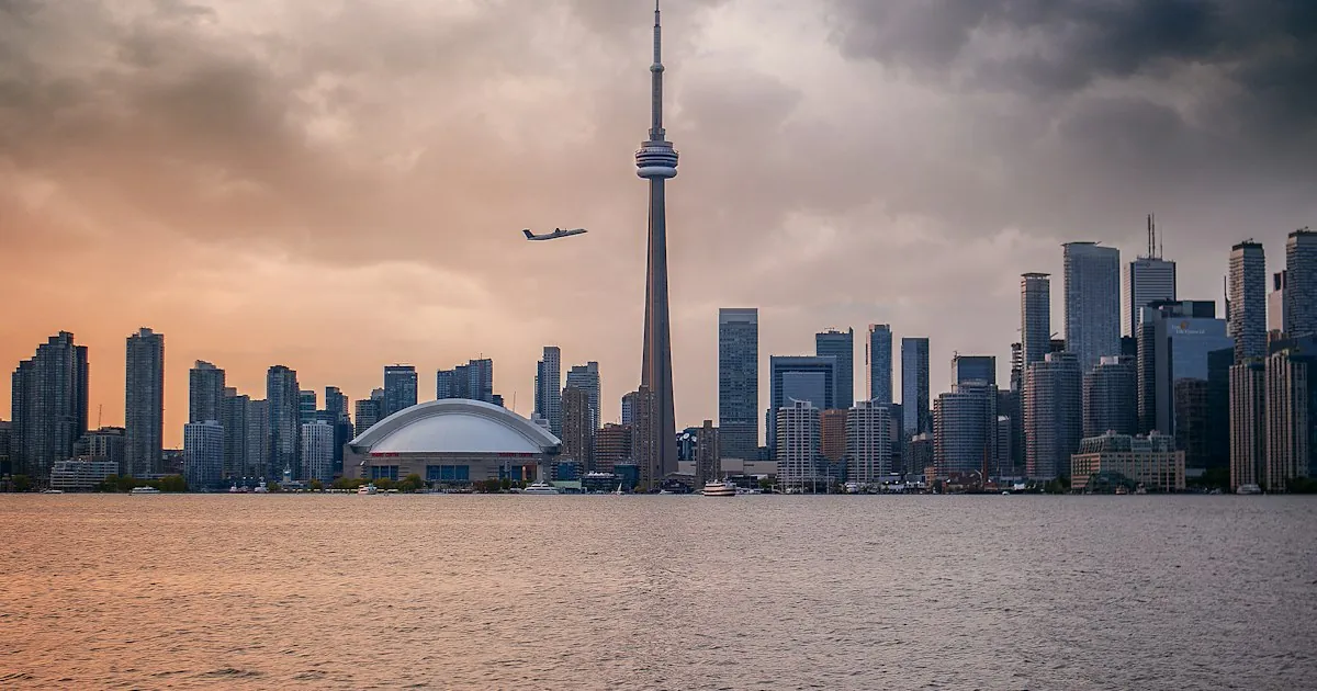 Toronto skyline at dusk — Canada's economic capital and the destination at the centre of a major 2026 reset in India-Canada business immigration and trade